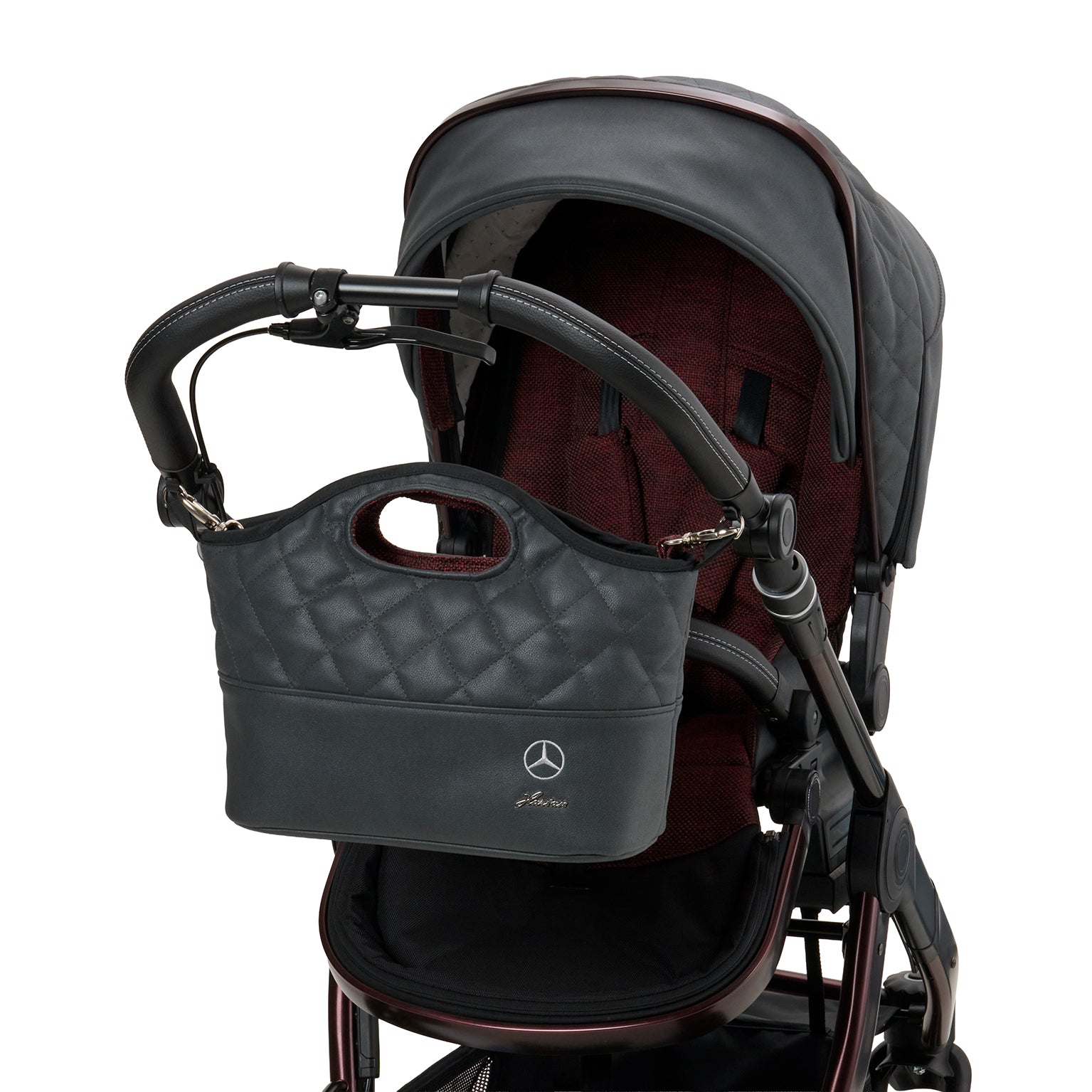 Bag2Go 614 / Rubellit befestigt am Kinderwagengestell.
Schräge Vorderansicht.