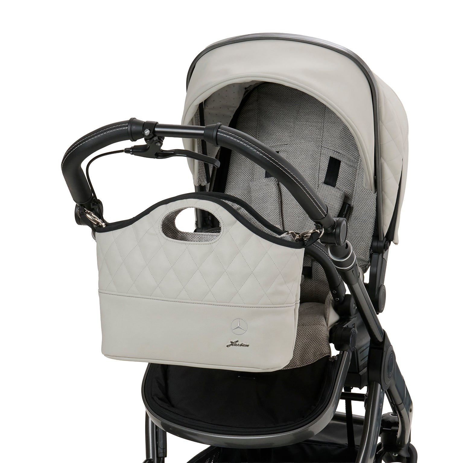 Bag2Go 615 / Opalith befestigt am Kinderwagengestell.
Schräge Vorderansicht.